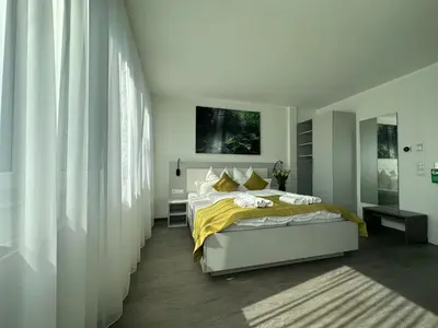 Ein Bett oder Betten in einem Zimmer der Unterkunft GuestHouse Große Linde
