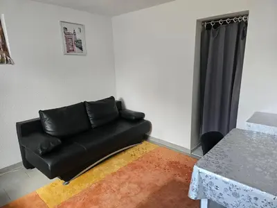 Ein Sitzbereich in der Unterkunft Flat Bangoua