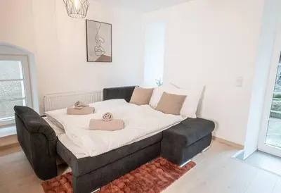 Ein Bett oder Betten in einem Zimmer der Unterkunft Residenz im Denkmal - Erlebnispark Tripsdrill - Familie - Freude - Spaß