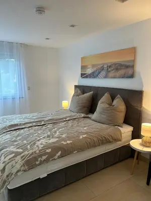 Ein Bett oder Betten in einem Zimmer der Unterkunft Alex Design Appartment