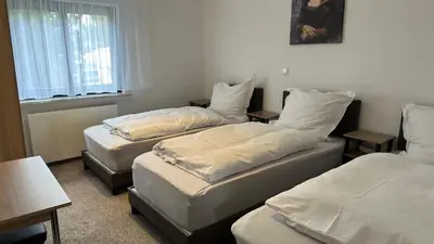 Ein Bett oder Betten in einem Zimmer der Unterkunft Hasenmühle
