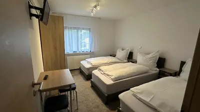 Ein Bett oder Betten in einem Zimmer der Unterkunft Hasenmühle