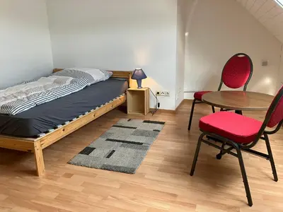 Ein Bett oder Betten in einem Zimmer der Unterkunft Stocksberg 1881 Apartments
