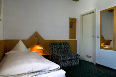 Ein Bett oder Betten in einem Zimmer der Unterkunft Hotel Deutsches Haus
