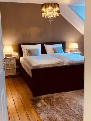 Ein Bett oder Betten in einem Zimmer der Unterkunft The Hampton Hock's - Wellness & Wine
