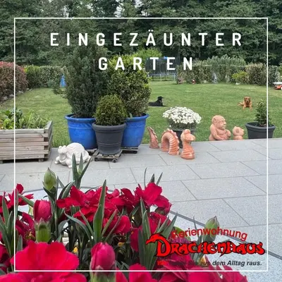 Ein Garten an der Unterkunft Ferienwohnung Drachenhaus WIR holen Sie aus dem Alltag raus