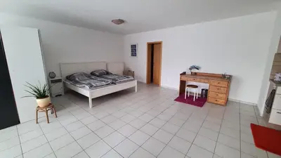 Ein Bett oder Betten in einem Zimmer der Unterkunft Ruhige Ferienwohnung am Rande des Nordschwarzwalds