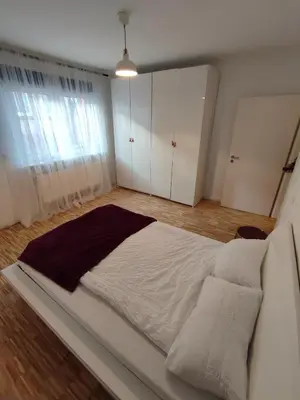 Ein Bett oder Betten in einem Zimmer der Unterkunft modernes Apartment in verkehrsgünstiger Lage