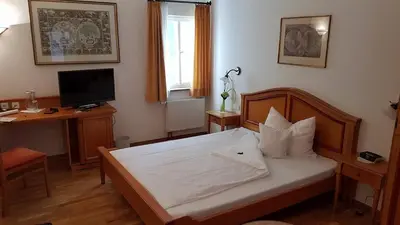 Ein Bett oder Betten in einem Zimmer der Unterkunft Boutique- und Businesshotel Herrenküferei
