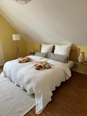 Ein Bett oder Betten in einem Zimmer der Unterkunft Wohnen am Seebach II