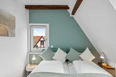 Ein Bett oder Betten in einem Zimmer der Unterkunft Feuerstein - 2 BR-Appartment Smart-TV