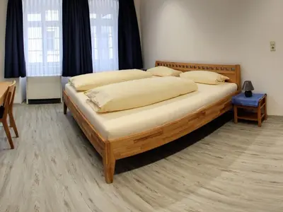 Ein Bett oder Betten in einem Zimmer der Unterkunft Gästehaus Ritter
