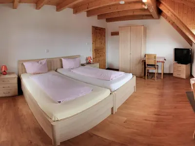 Ein Bett oder Betten in einem Zimmer der Unterkunft Gästehaus Ritter