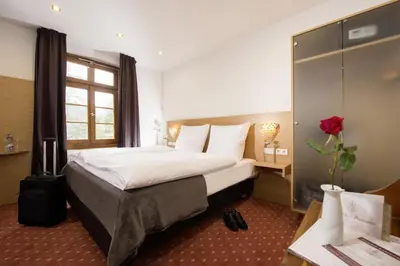 Ein Bett oder Betten in einem Zimmer der Unterkunft Hotel Landgasthof König von Preussen