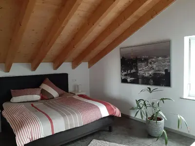 Ein Bett oder Betten in einem Zimmer der Unterkunft FeWoHerrmann