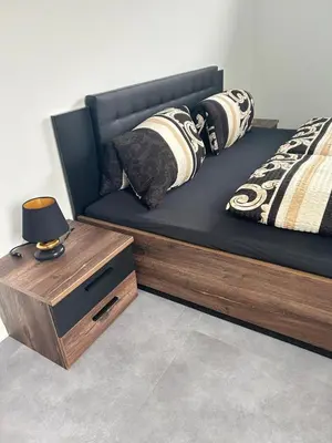 Ein Bett oder Betten in einem Zimmer der Unterkunft Apart das Ehrets mit 3 Schlafzimmer