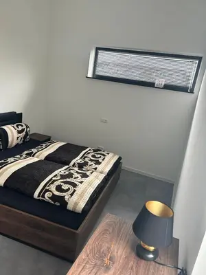 Ein Bett oder Betten in einem Zimmer der Unterkunft Apart das Ehrets mit 3 Schlafzimmer