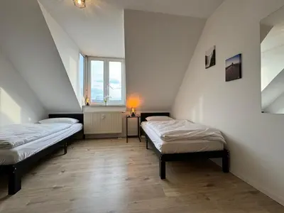 Ein Bett oder Betten in einem Zimmer der Unterkunft Gemütliches Apartment für 2 Personen nahe RaumFabrik - Durlach by Rabe