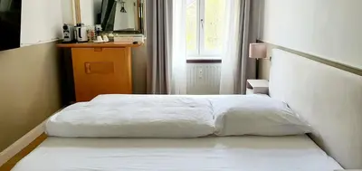 Ein Bett oder Betten in einem Zimmer der Unterkunft Premium Studio in zentraler Lage Mannheims