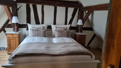 Ein Bett oder Betten in einem Zimmer der Unterkunft Schmuckstück-Maikammer