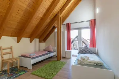 Ein Bett oder Betten in einem Zimmer der Unterkunft Maisonette-Wohnung mit 5 Schlafzimmern