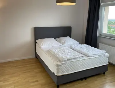 Ein Bett oder Betten in einem Zimmer der Unterkunft Alice Holiday Apartment