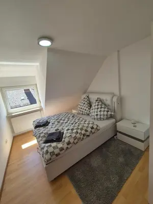 Ein Bett oder Betten in einem Zimmer der Unterkunft FeWo Neckarsteinach