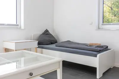Ein Bett oder Betten in einem Zimmer der Unterkunft 105qm Wohnung für max. 7 Personen