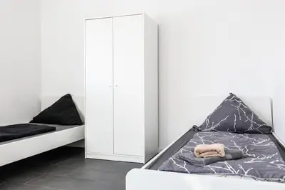 Ein Bett oder Betten in einem Zimmer der Unterkunft 105qm Wohnung für max. 7 Personen