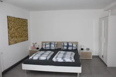 Ein Bett oder Betten in einem Zimmer der Unterkunft Ferienwohnung Jungpfalzstieg