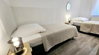 Ein Bett oder Betten in einem Zimmer der Unterkunft Ferienwohnungen Krüger 'Apartment Marina'