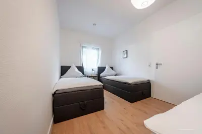 Ein Bett oder Betten in einem Zimmer der Unterkunft XXL Appartement Highdesign 10 Pers zentral nähe Heidelberg und Mannheim