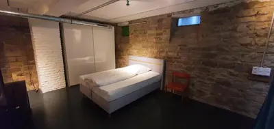Ein Bett oder Betten in einem Zimmer der Unterkunft Loft im Szeneviertel Mannheims