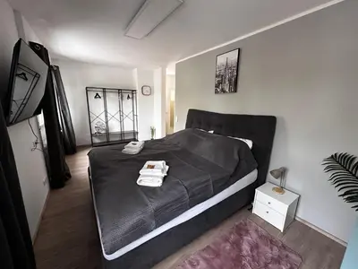 Ein Bett oder Betten in einem Zimmer der Unterkunft Premium Apartments Schwetzingen, Heidelberg, Speyer