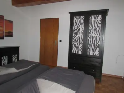 Ein Bett oder Betten in einem Zimmer der Unterkunft Ferienwohnung am Heuchelberg