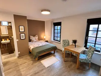 Ein Bett oder Betten in einem Zimmer der Unterkunft Nahe Frankfurt Flughafen & Messe