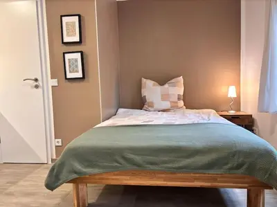 Ein Bett oder Betten in einem Zimmer der Unterkunft Nahe Frankfurt Flughafen & Messe