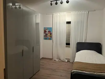 Ein Bett oder Betten in einem Zimmer der Unterkunft Moderne Ferienwohnung in Dilsberg