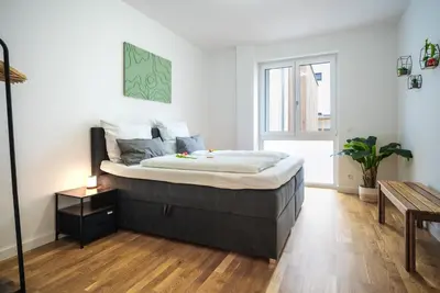 Ein Bett oder Betten in einem Zimmer der Unterkunft Großes zentrales Apartment Terrasse 2 Bäder