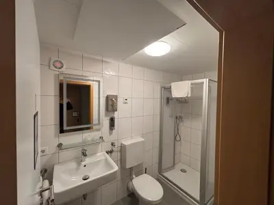 Ein Badezimmer in der Unterkunft Hotel Sonne