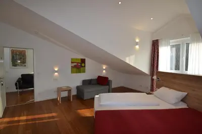 Ein Bett oder Betten in einem Zimmer der Unterkunft Weinhaus Steppe Hotel 3***Superior und Weinstube