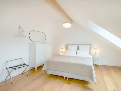 Ein Bett oder Betten in einem Zimmer der Unterkunft FLAIR Homes - Design Apartments with Smart-TV, Self Check-in & Free Parking