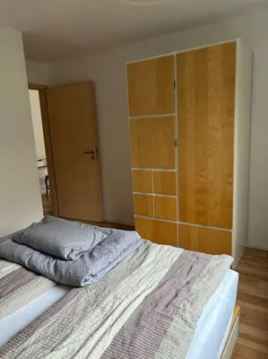 Ein Bett oder Betten in einem Zimmer der Unterkunft Ferienwohnung am Wartturm