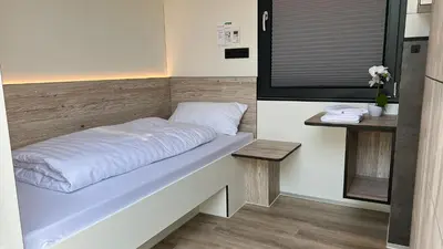 Ein Bett oder Betten in einem Zimmer der Unterkunft Roatel Gimbsheim B9 my-roatel-com