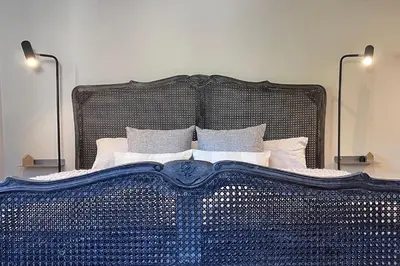 Ein Bett oder Betten in einem Zimmer der Unterkunft Ferienwohnung Seckenheim - stilvoll übernachten zwischen Mannheim und Heidelberg ideal für Kurztrips