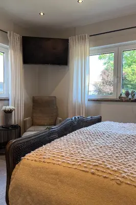 Ein Bett oder Betten in einem Zimmer der Unterkunft Ferienwohnung Seckenheim - stilvoll übernachten zwischen Mannheim und Heidelberg ideal für Kurztrips