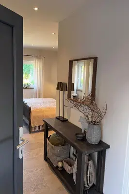 Ein Bett oder Betten in einem Zimmer der Unterkunft Ferienwohnung Seckenheim - stilvoll übernachten zwischen Mannheim und Heidelberg ideal für Kurztrips