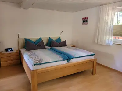 Ein Bett oder Betten in einem Zimmer der Unterkunft Ferienwohnung Lang