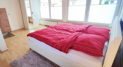 Ein Bett oder Betten in einem Zimmer der Unterkunft Gemütliches Gästehaus am Park