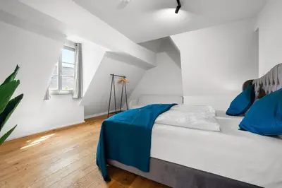 Ein Bett oder Betten in einem Zimmer der Unterkunft LiT LiVING Grünstadt - Luxury- style Boutique Apartments